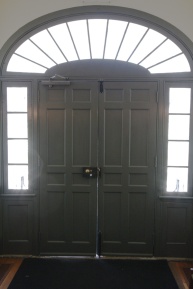 The main entry door to a building built in the early 1800s.
